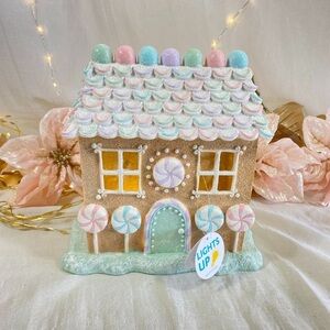 At Home Mrs Claus’ Bakery Gingerbread house pastel Christmas holiday decor candy